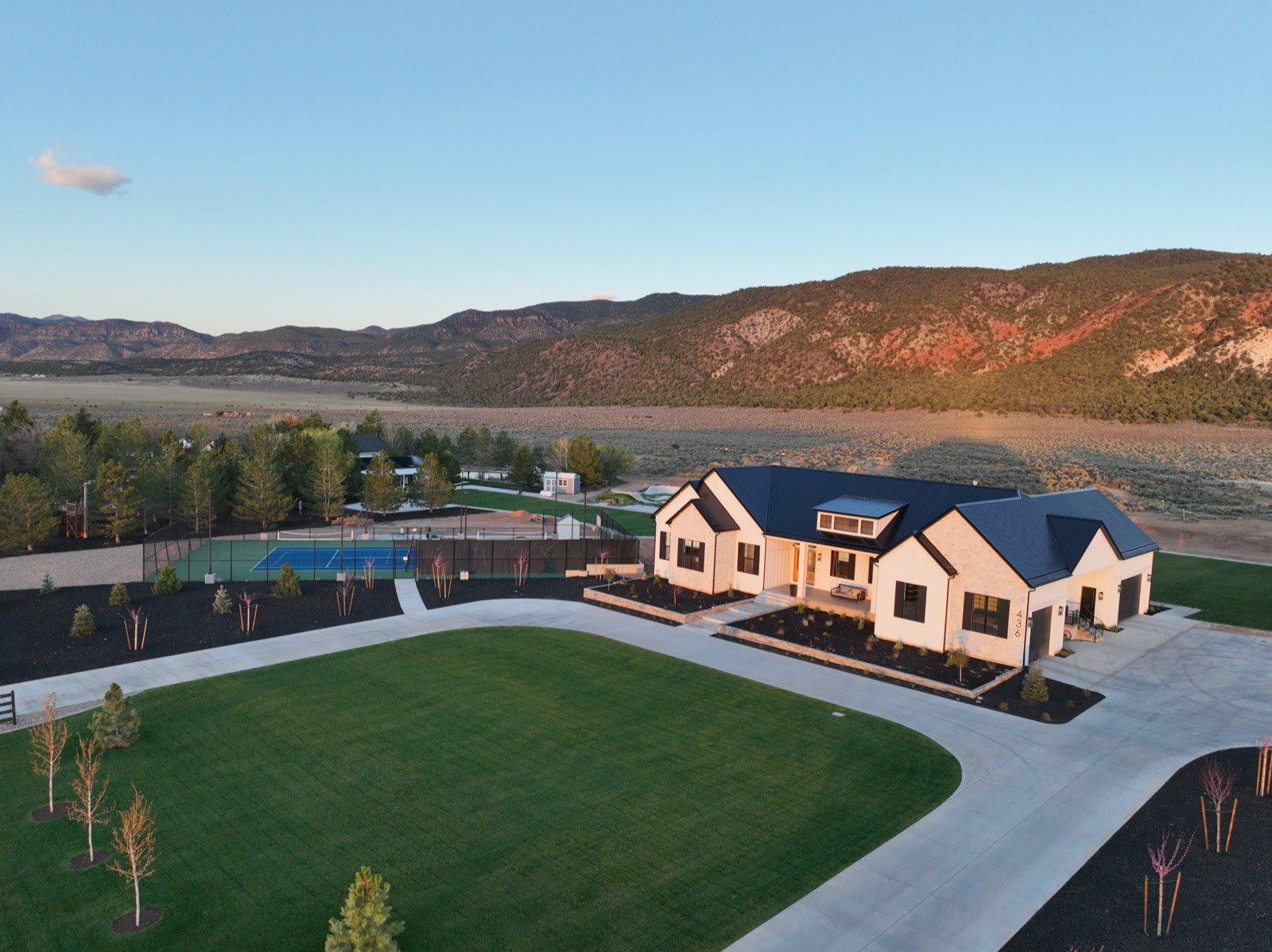Aerial view of Redstone Peaks property at golden hour